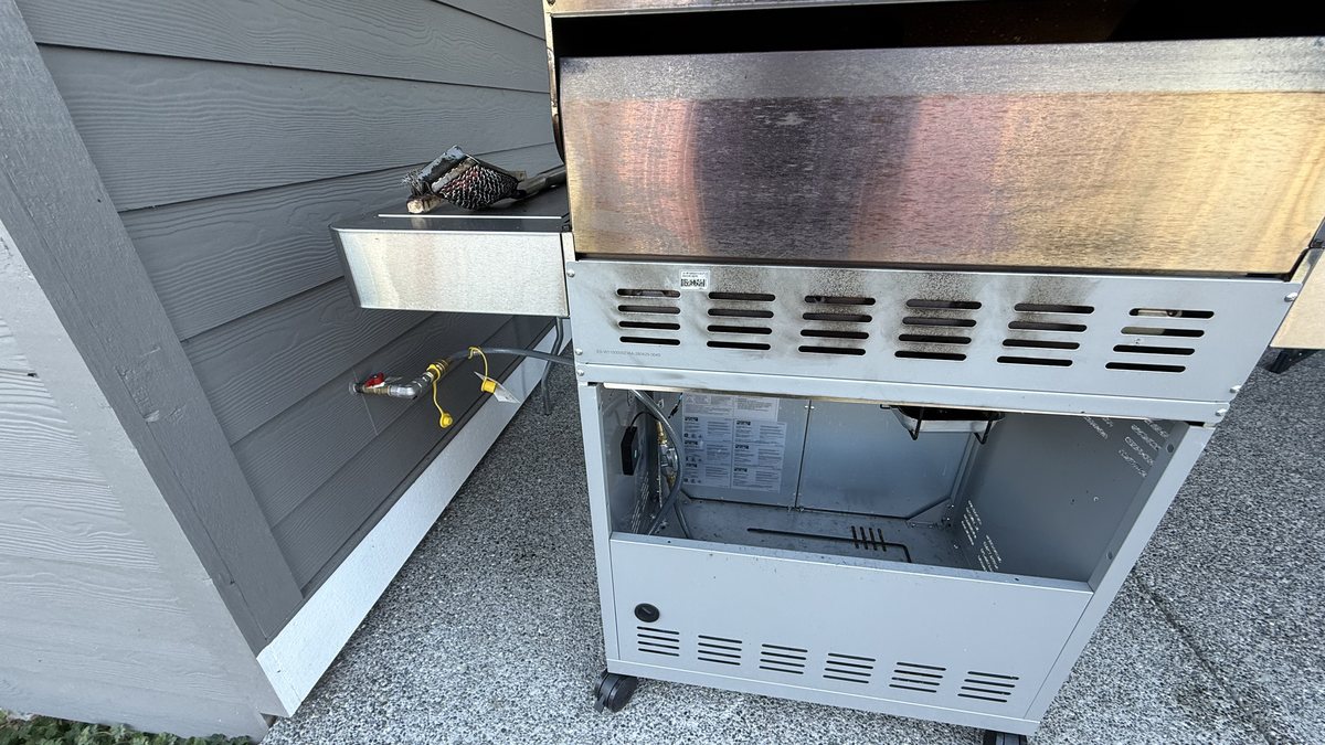 Real photograph of a gas grill installation
